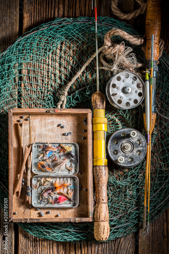 Top view of fishing tackle with flies, floats and rods