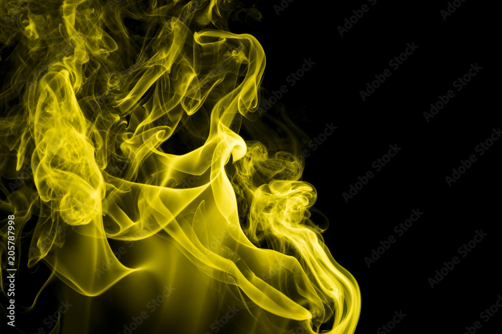 Fototapeta premium Yellow smoke on black background