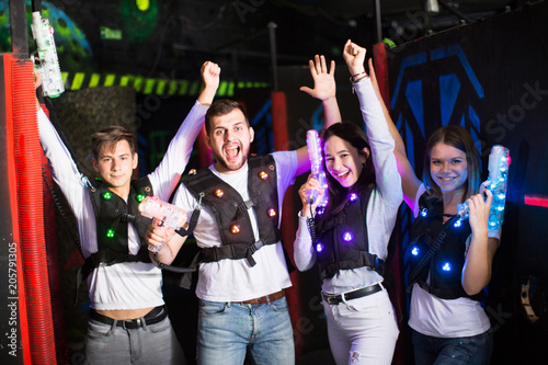 Young people in laser tag labyrinth