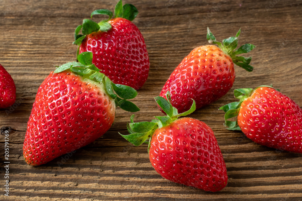 Ripe strawberries on a wooden table