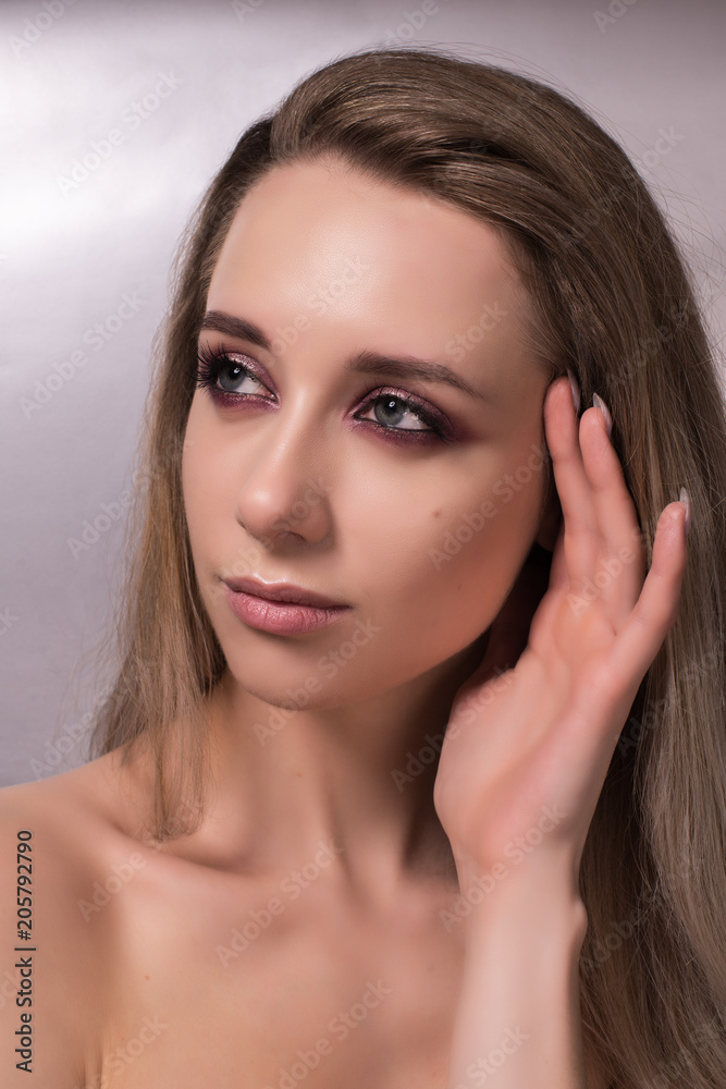 Beautiful young girl on a gray background. Beautiful young girl on a gray background.