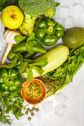 Fototapeta Naklejka Na Ścianę i Meble -  Green vegetables on a white background. Vegetable vegan diet food background, top view. Healthy lifestyle concept.