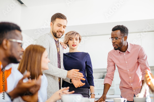 close up portrait of freelancers talking about deal during break photo