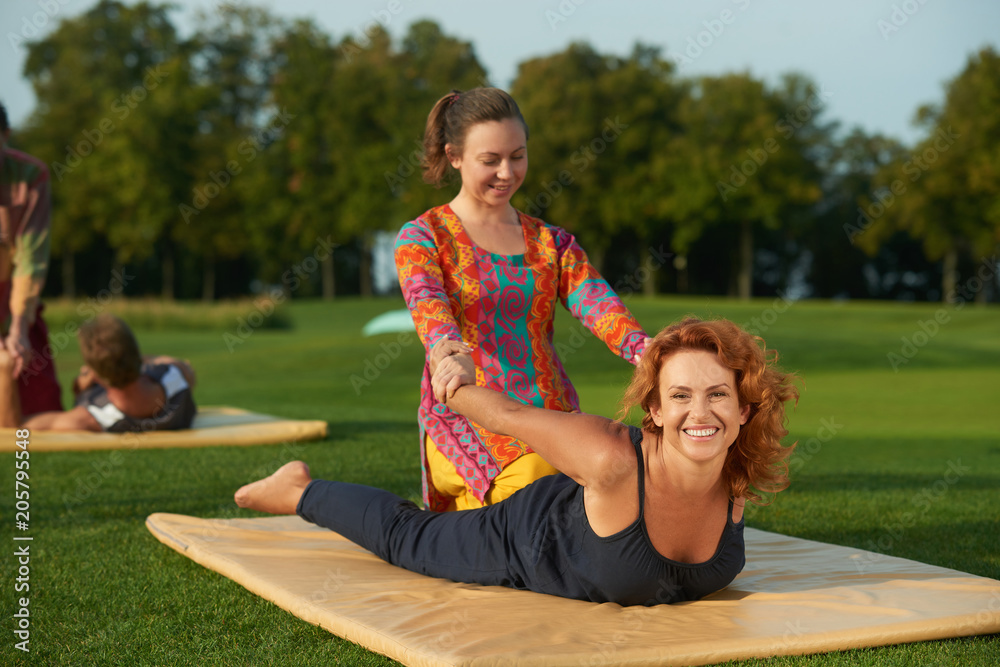 Shiatsu thai massage mat. Two women making thai yoga massage outdoor in the  park. Stock Photo | Adobe Stock