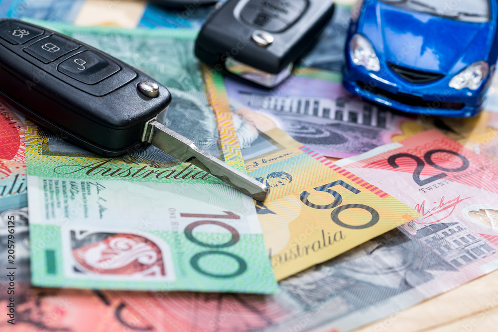 'Purchasing or rental' conception with toy car and australian dollars 'Purchasing or rental' conception with toy car and australian dollars