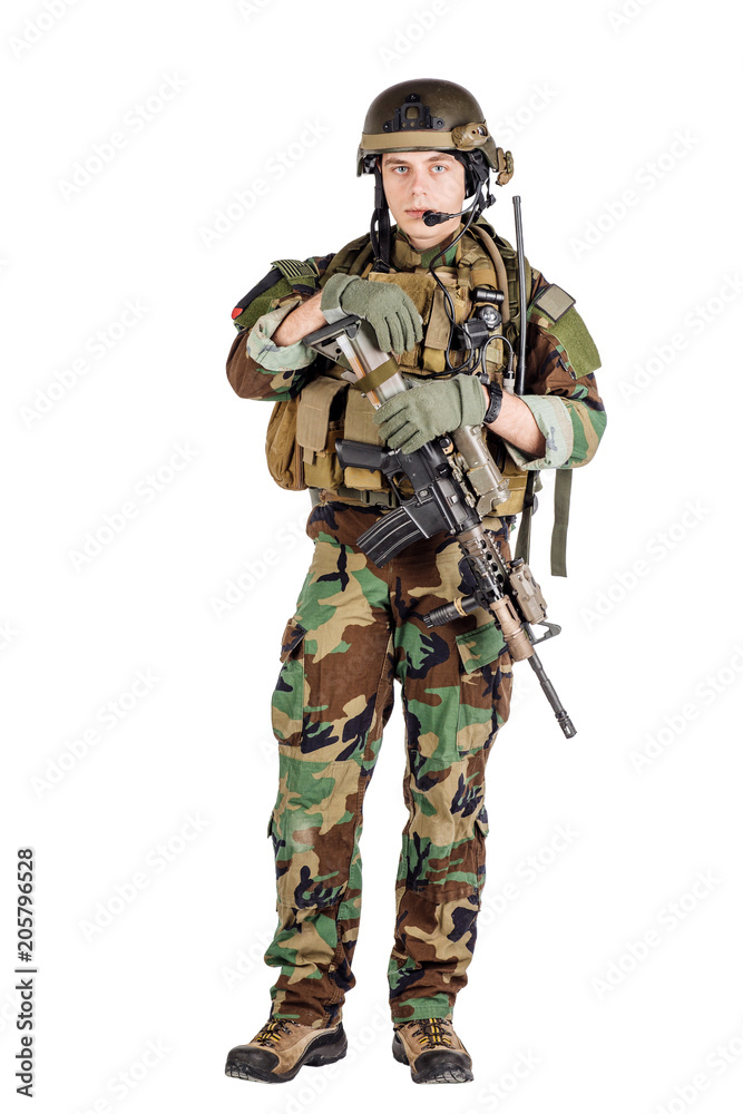 Portrait soldier or private military contractor holding sniper rifle. Portrait soldier or private military contractor holding sniper rifle.