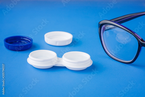 glasses and contact lenses in containers