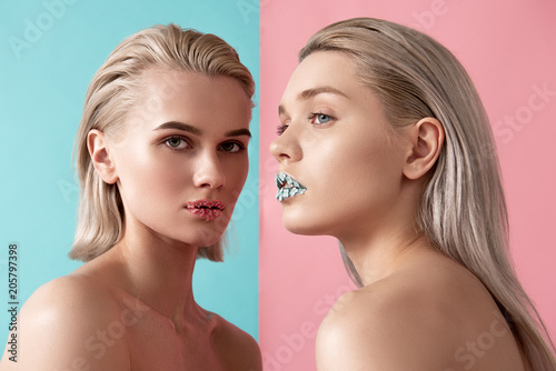 Blonde women with pretty appearance having own style. Applique is on their lips. Isolated on pink and blue background