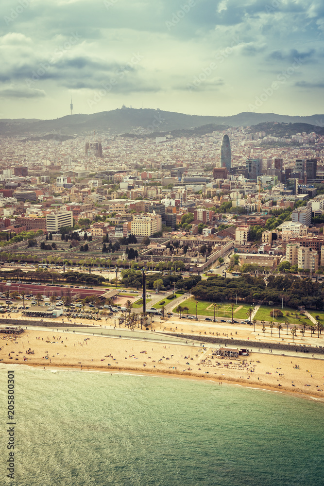Fototapeta premium Barcelona aerial, city skyline and the beach, Spain. Helicopter view. Vintage colors