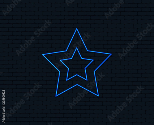 Neon light. Star sign icon. Favorite button. Navigation symbol. Glowing graphic design. Brick wall. Vector