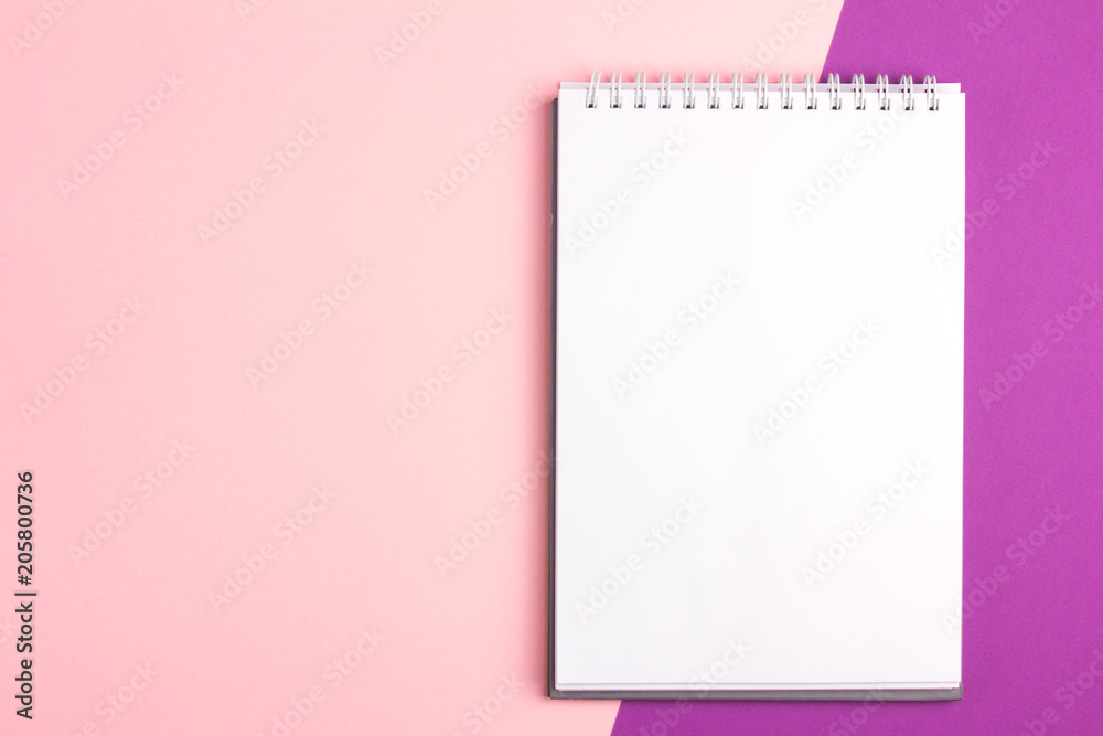 Blank notebook on pink purple pastel background. Flat lay concept with copy space Blank notebook on pink purple pastel background. Flat lay concept with copy space