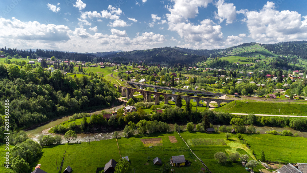 Aerial view of Carpathian mountains in summer. Village in the mountains.