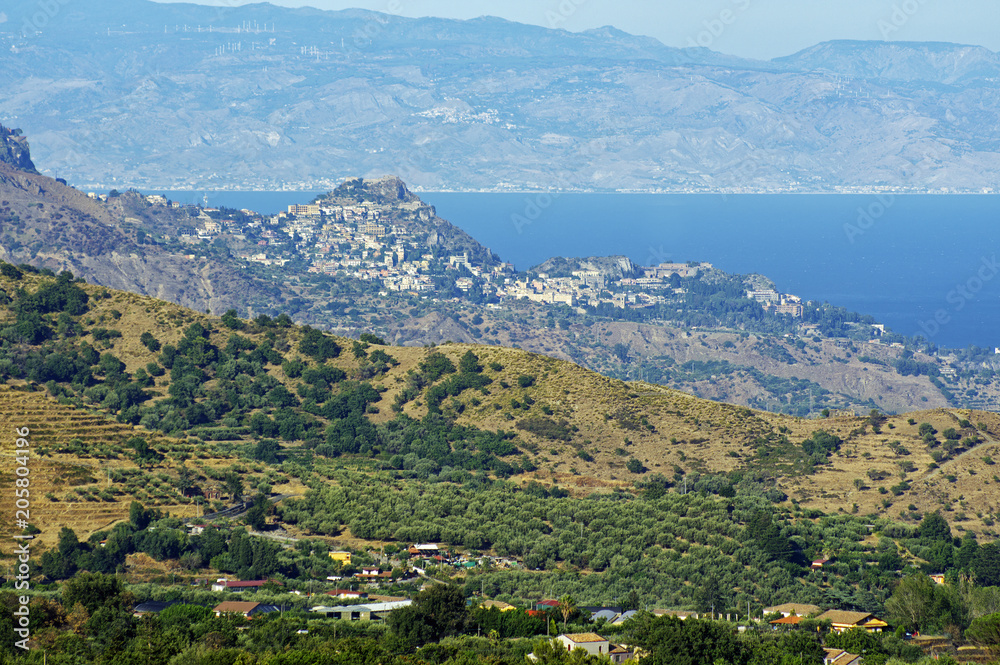 The pictures landscape of Sicily coast with Castelmola, Taormina and Giardini Naxos towns view in the background.Sicily, Italy