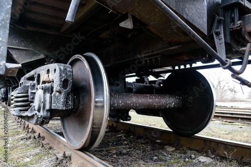 Railway transport: Iron wheels of the freight car on rails.