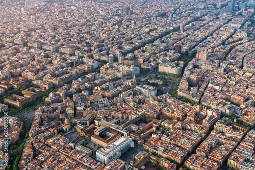 Barcelona aerial view of Placa de Catalunya with typical urban grid, Spain. Late afternoon light
