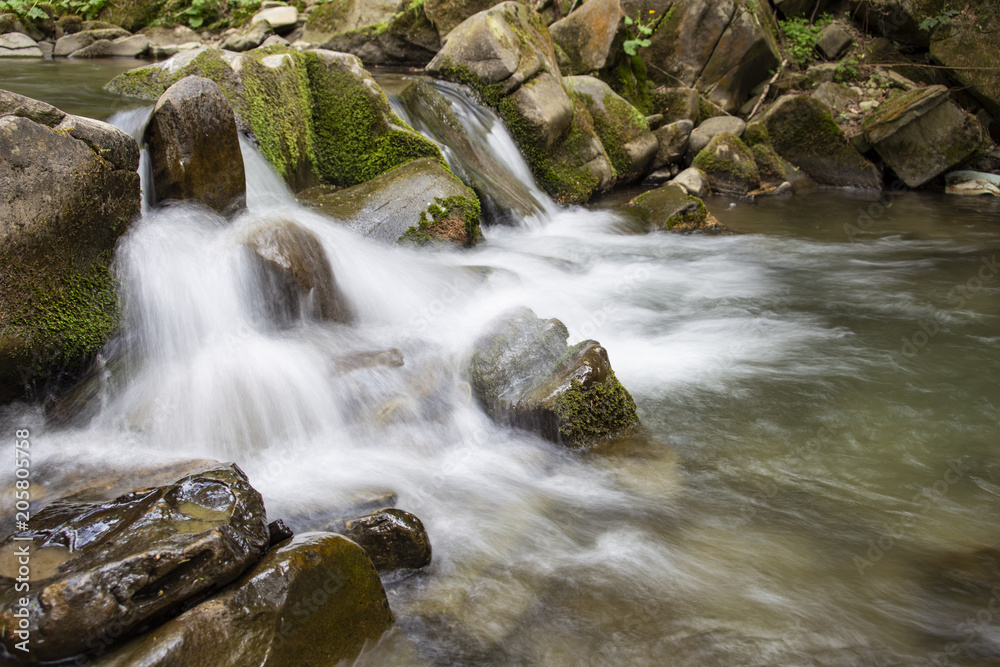 Water cascade on a mountain stream
