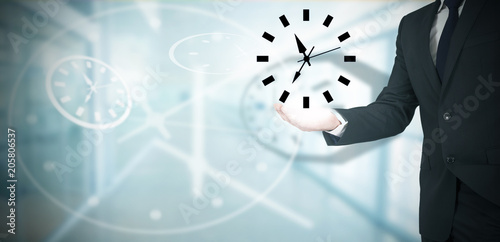 business man with watch in hand, working time concept photo