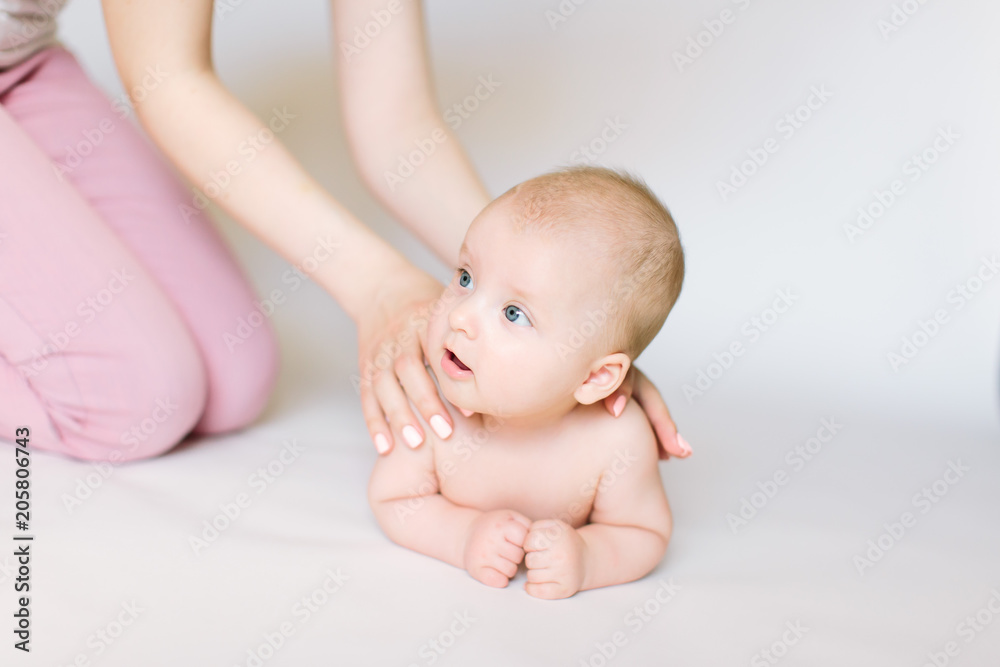little baby massage back, isolated on white. little baby massage back, isolated on white.