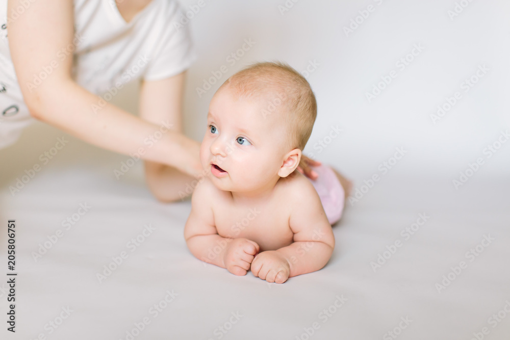 little baby massage back, isolated on white. little baby massage back, isolated on white.