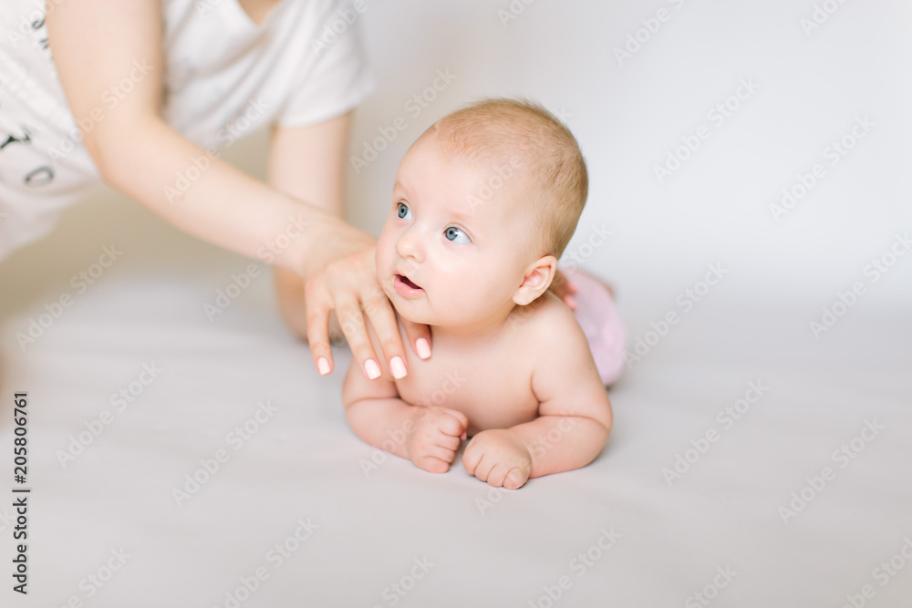 little baby massage back, isolated on white. little baby massage back, isolated on white.