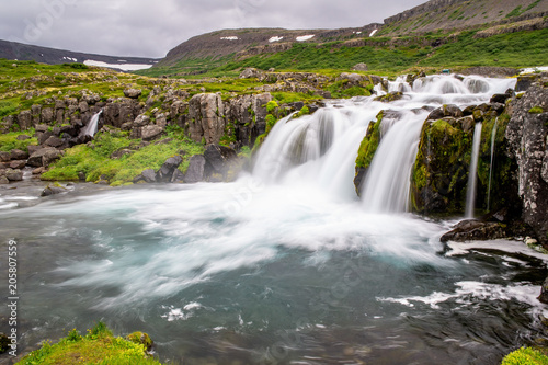 Baejarfoss waterfall under more famous Dynjandi fall in Iceland  Europe taken with long exposure making a motion blur effect