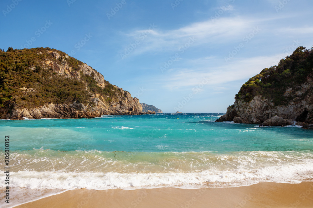 Beautiful turquoise beach in a bay at Paleokastritsa in Corfu, Greece Beautiful turquoise beach in a bay at Paleokastritsa in Corfu, Greece