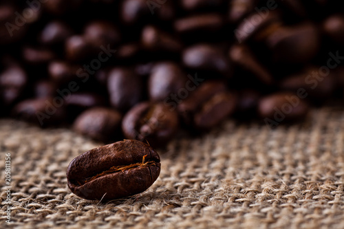Dark roasted coffee beans with a hessian or jute natural colour sacking