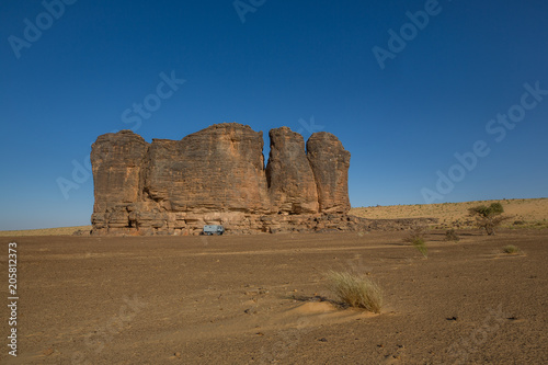 Camp with 4x4 expedition verhicle at massive rock formation – Mauritania