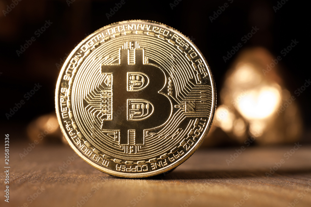 bitcoin token on wooden surface