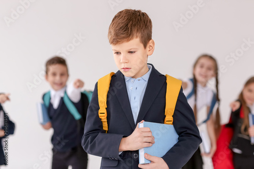 Children bullying their cla...