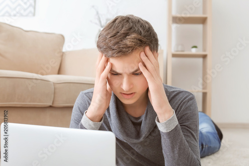 Depressed teenager using la...