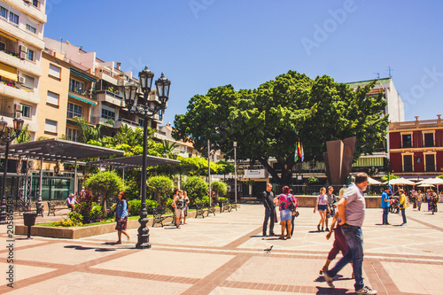 Fototapeta Naklejka Na Ścianę i Meble -  Street. A sunny day in the street of Fuengirola. Malaga province, Andalusia, Spain. Picture taken – 15 may 2018.