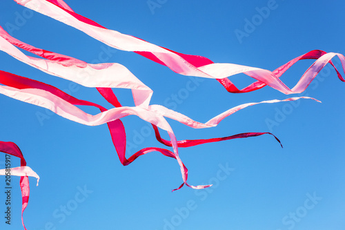 festival ribbons and flags fluttering downwind