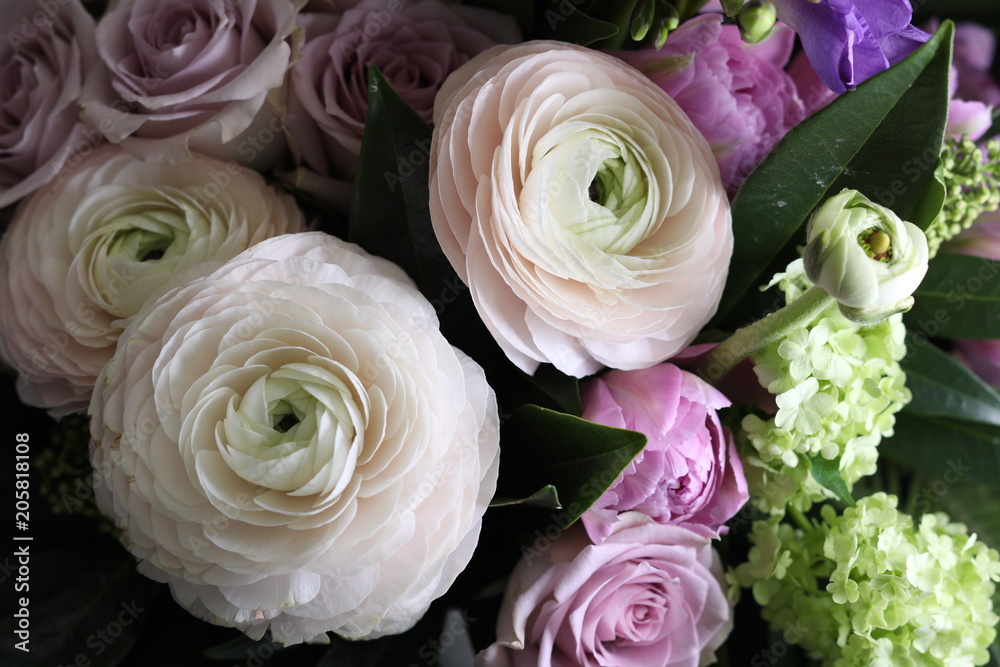 Obraz premium Bouquet of ranunculus and roses. Close up