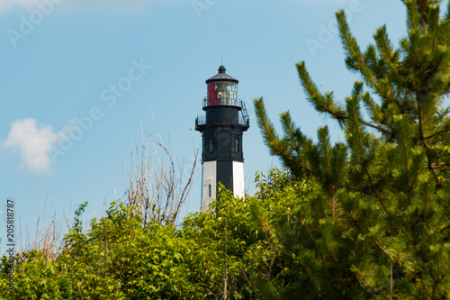 Built in 1881, the New Cape Henry Lighthouse stands high above surrounding trees on the southern entrance to Chesapeake Bay on the Fort Story military base.