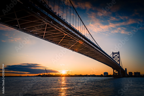 Ben Franklin bridge and Philadelphia rising at dawn. photo