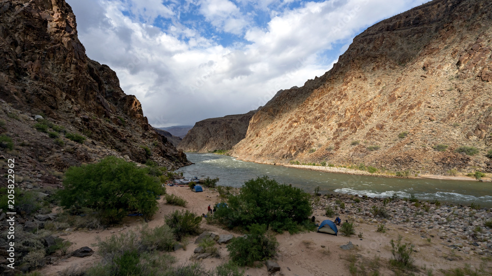 Campsite along Colorado River running through Grand Canyon providing exciting whitewater rafting and incredible views along the way. Numerous side canyons can be hiked, often to beautiful waterfalls.