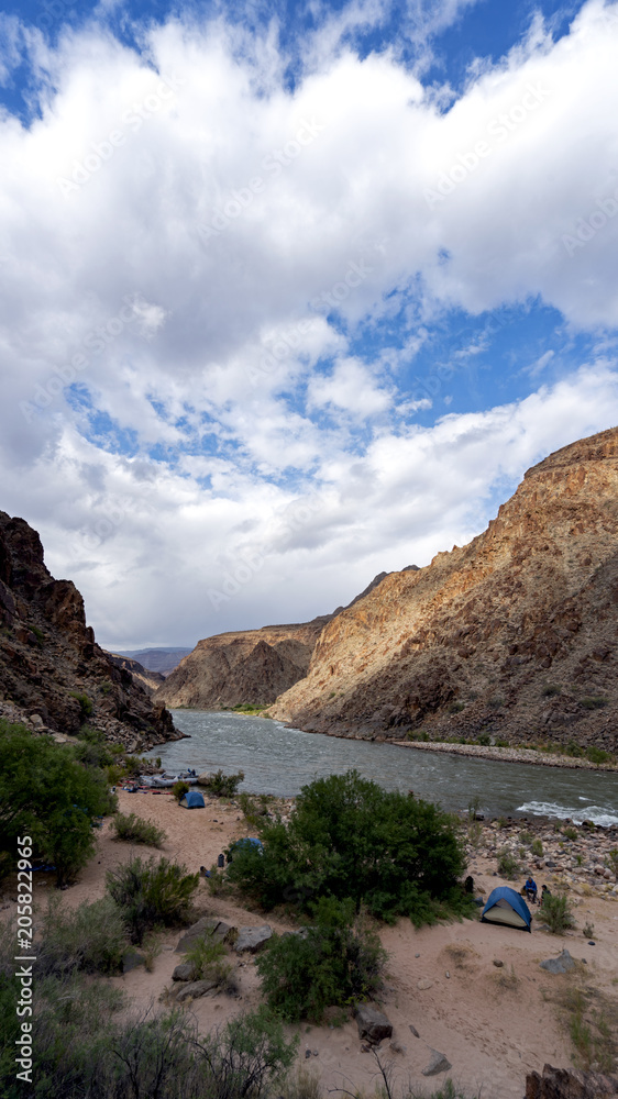 Campsite along Colorado River running through Grand Canyon providing exciting whitewater rafting and incredible views along the way. Numerous side canyons can be hiked, often to beautiful waterfalls.