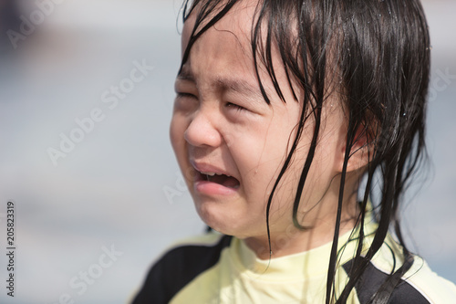Asian Little Chinese Girl crying in Swimming Pool