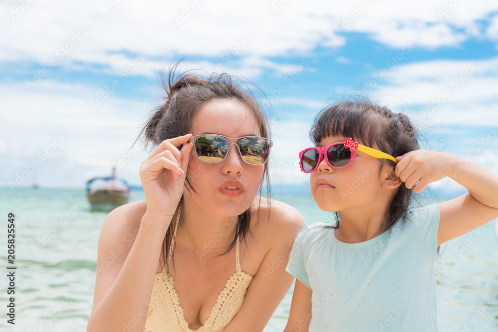 little girl and her mother have a good time at the seaside resort little girl and her mother have a good time at the seaside resort