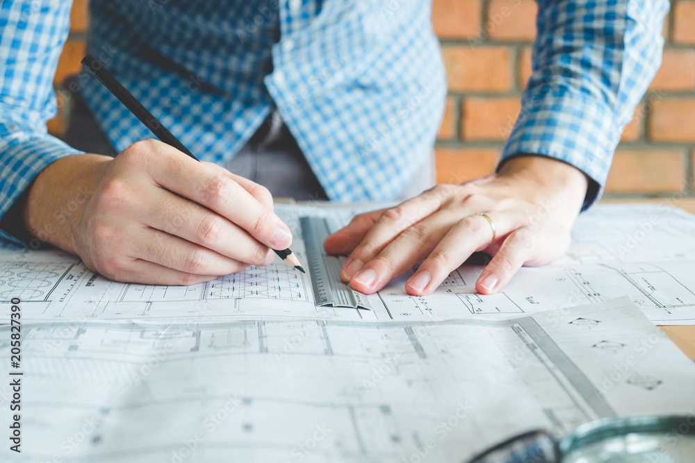 Architect or engineer working in office on blueprint. Architects workplace Architect or engineer working in office on blueprint. Architects workplace