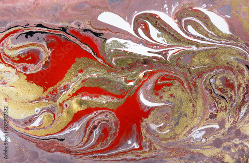 Marble abstract acrylic background. Pink and red marbling artwork texture. Agate ripple pattern. Gold powder.