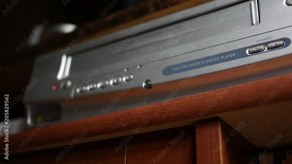 Removing a VHS Tape into VHS player Normal version Stockvideo Adobe Stock