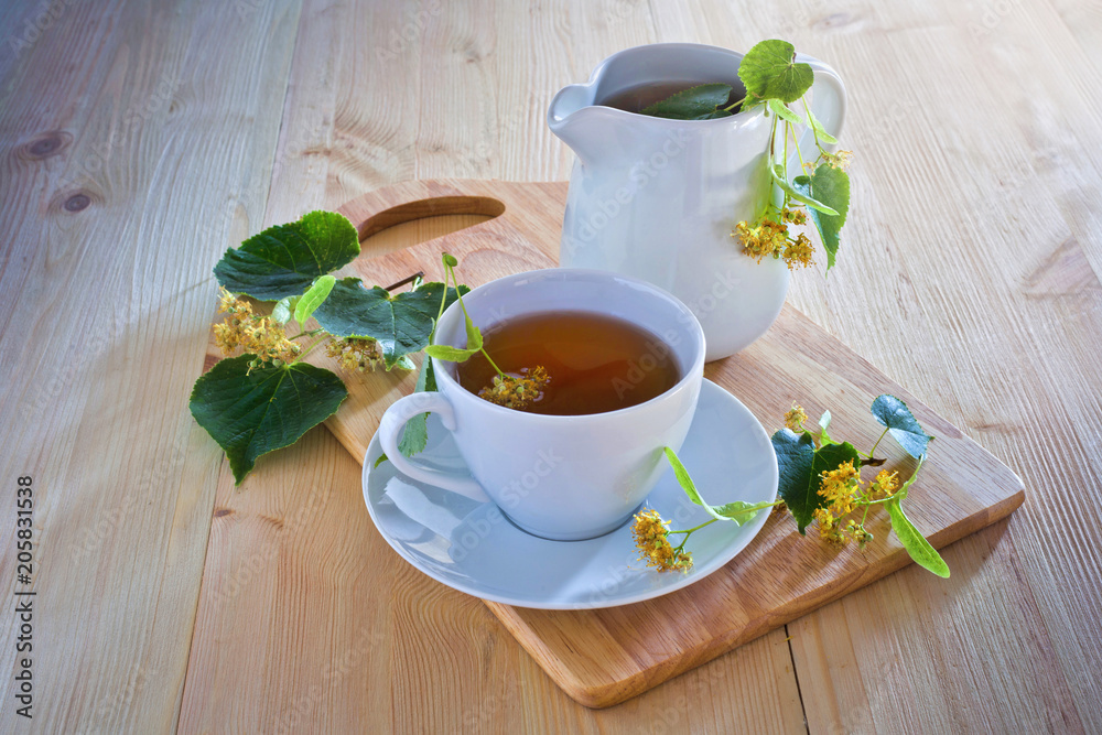 Linden tea on wooden table Linden tea on wooden table
