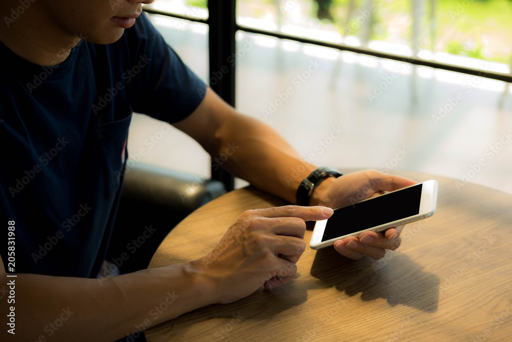 Close up of a man using mobile smart phone on the table. Close up of a man using mobile smart phone on the table.