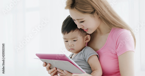 mommy use tablet with son