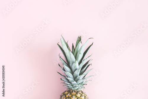 Pineapple on pastel pink background. Summer concept. Flat lay, top view