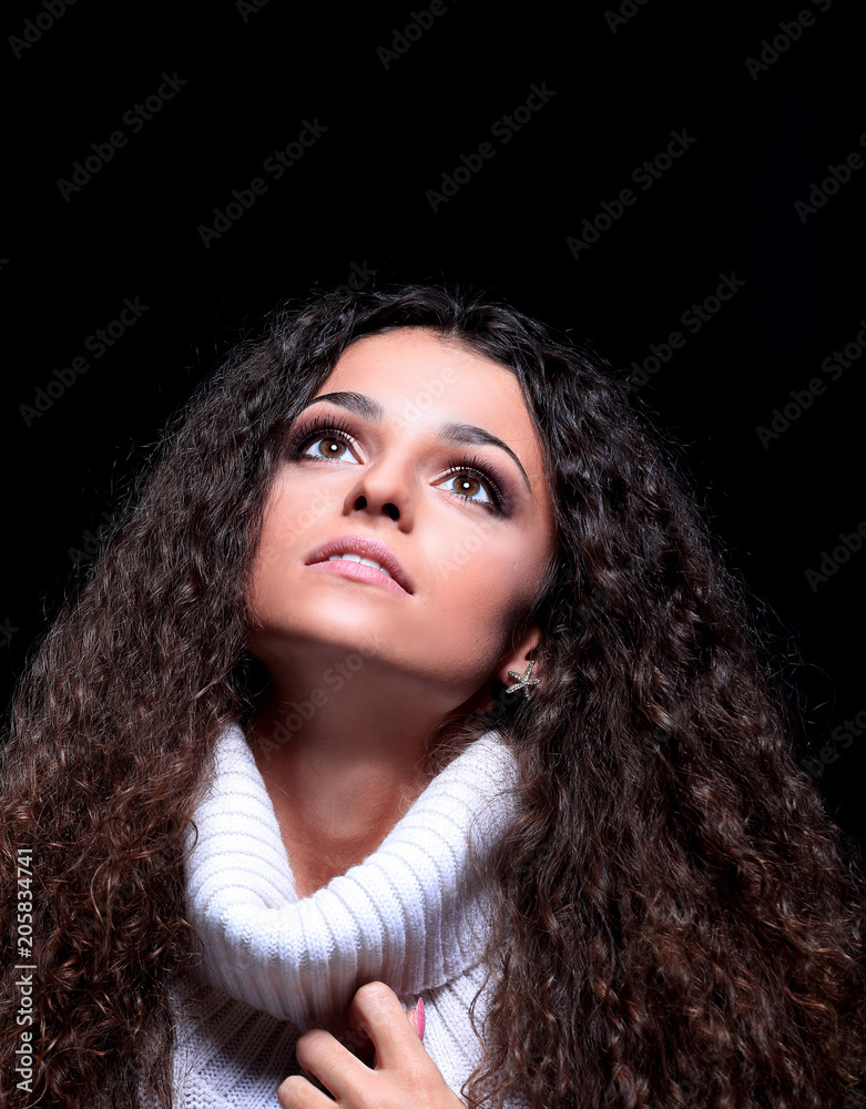 beautiful women with long hair in a sweater looking up. beautiful women with long hair in a sweater looking up.