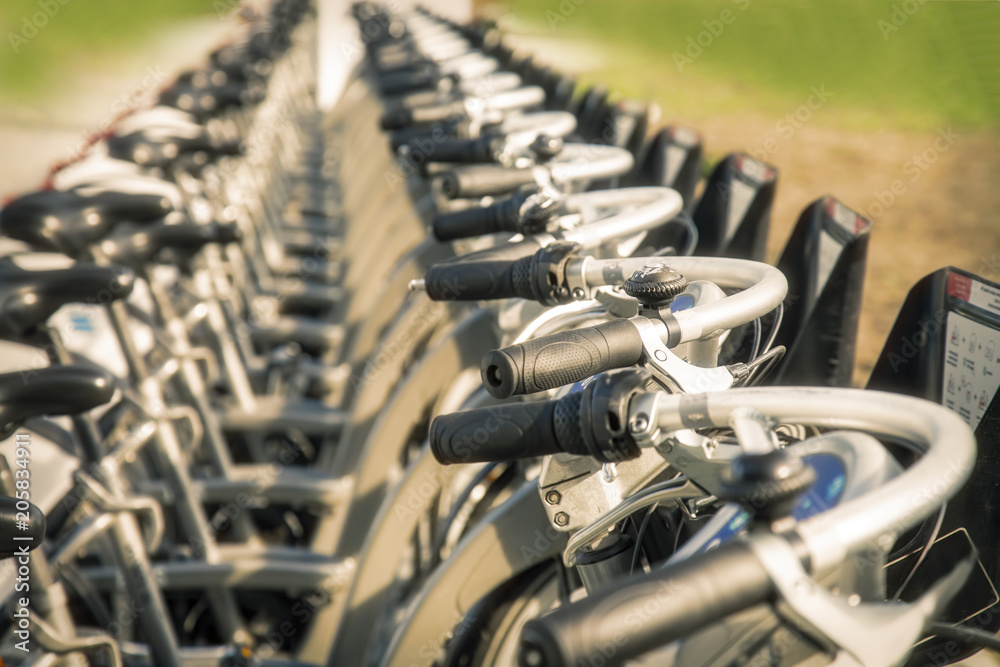 Close up of rental bicycles on rental station on the street Close up of rental bicycles on rental station on the street