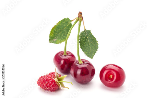 Cherry and raspberry isolated on white background. Vegetarian food.